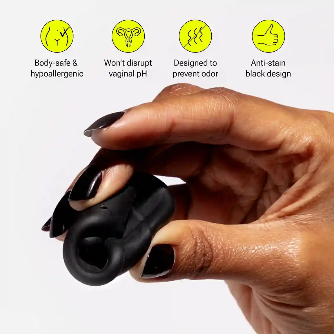 Hand holding folded menstrual disc with labeled benefits above