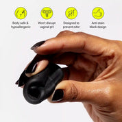 Hand holding folded menstrual disc with labeled benefits above