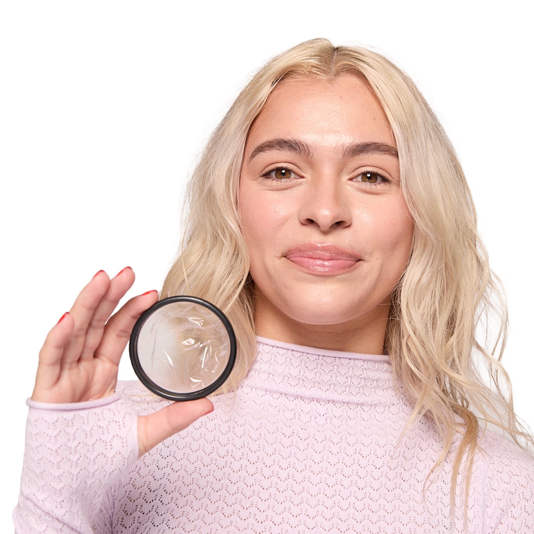 person-holding-menstrual-disc-closeup.jpg