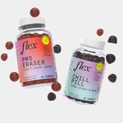 Two bottles of dietary supplement gummies labeled PMS Eraser and Chill Pill with scattered gummies around them